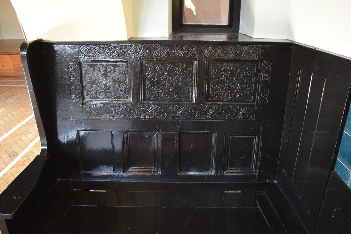 Village Hall Carved Bench in Fireplace