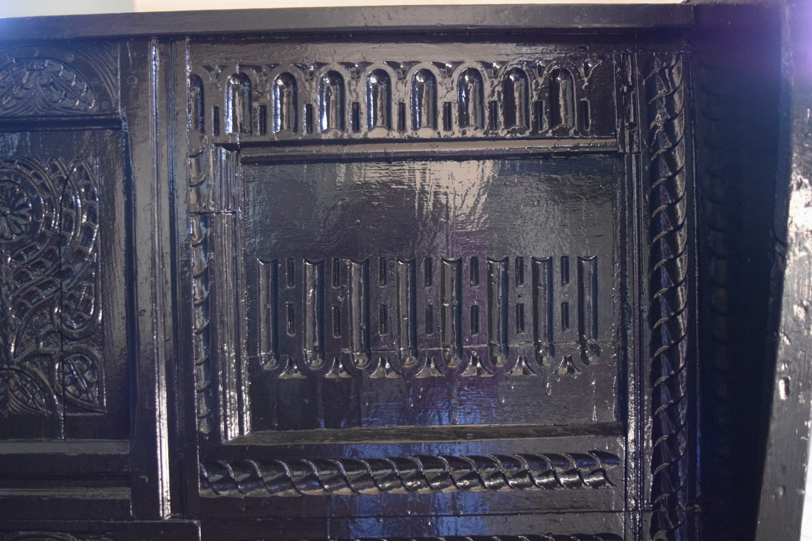 Village Hall Carved Bench in Fireplace